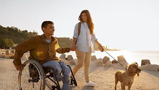 A group of individuals with disabilities enjoying outdoor activities with disability support services melbourne