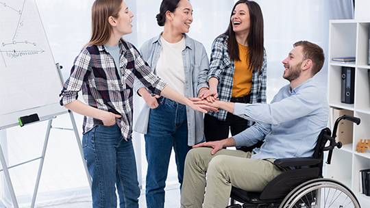 A group of individuals engaged in a cheerful indoor activity under STA services Melbourne