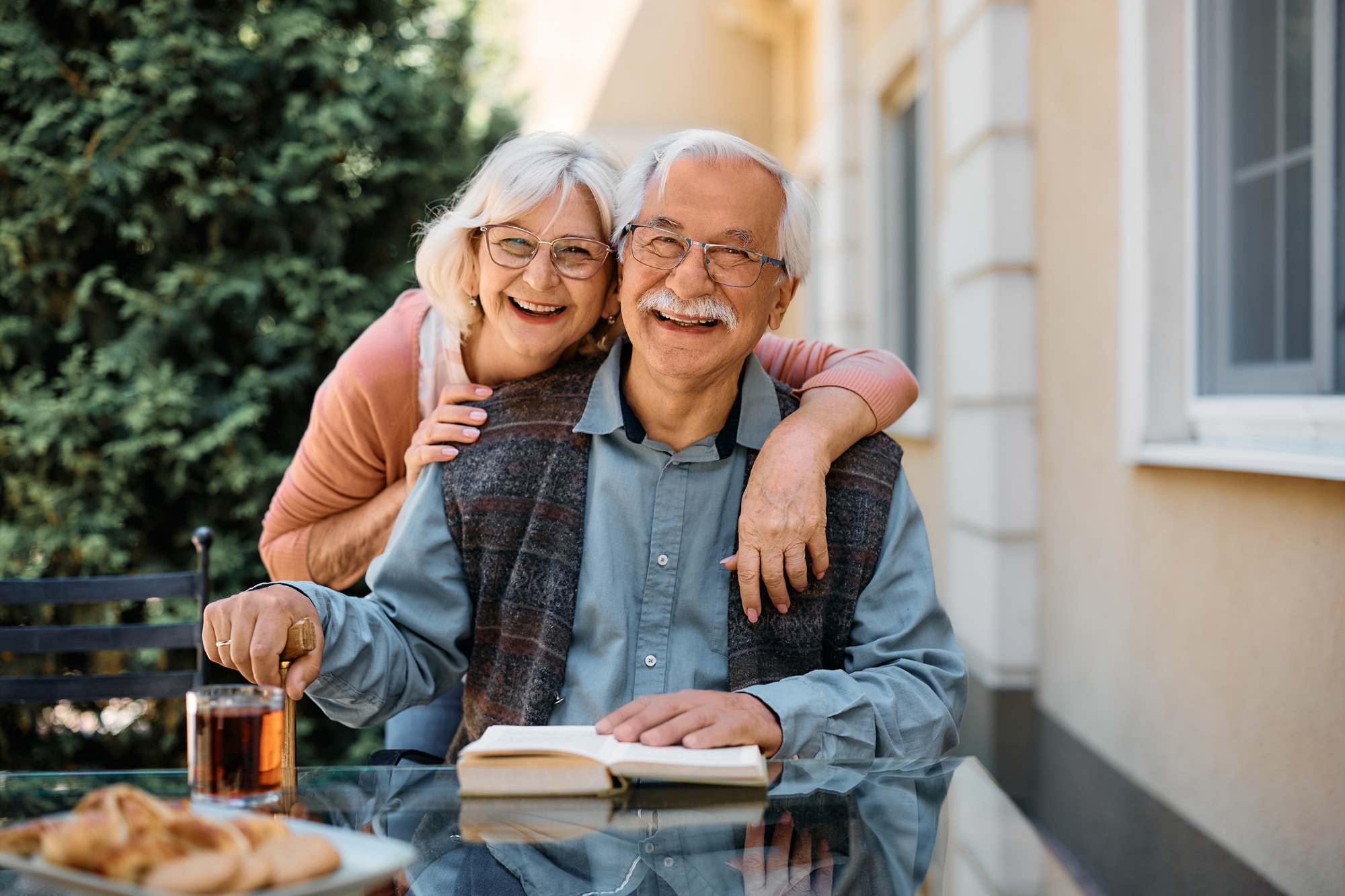 An elderly couple enjoying a joyful moment outdoors, symbolizing care, companionship, and sil providers melbourne