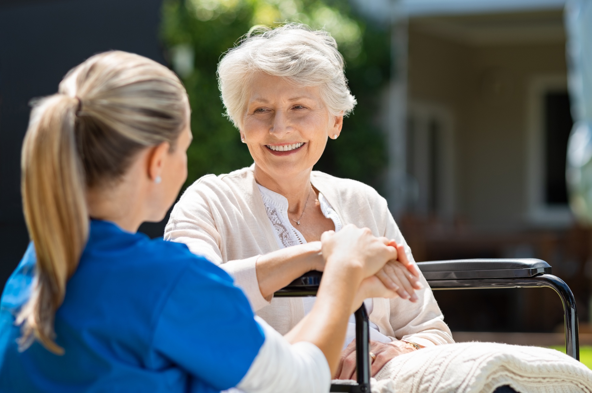 Seniors enjoying a group conversation over tea, representing Capacity Building NDIS by CareCompatible Australia.